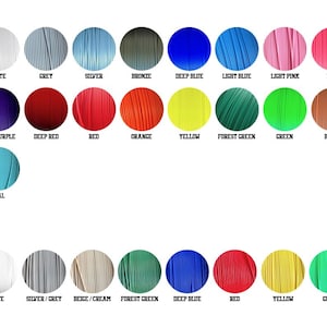 May include: A color chart featuring PLA and PETG colors. The PLA colors include black, white, grey, silver, bronze, deep blue, light blue, light pink, pink, light purple, purple, deep purple, deep red, red, orange, yellow, forest green, green, brown, light khaki, gold, and teal.
