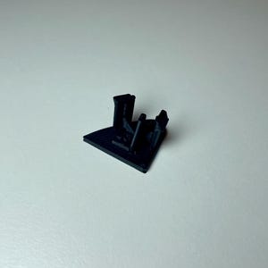 Black triangle cover plate shown on a white background