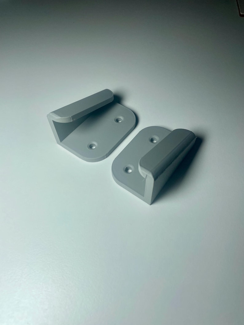 grey mounts shown on a white desk