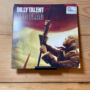 May include: A vinyl record album cover featuring a person holding a red flag with the text "BILLY TALENT RED FLAG" and the Virgin Records label with a price tag of $5.99.