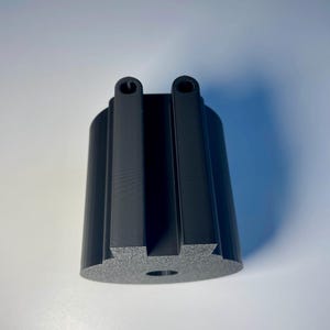 Cup holder for the trak racer TR8 in black on a white desk