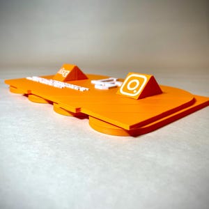 May include: Bright orange platform with two triangular accents, one with the Etsy logo and the other with the Instagram logo. The platform has a layered design with rounded edges and white text.