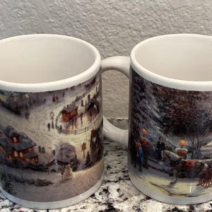 Thomas Kinkade Mugs. Victorian Christmas and Saint Nicolas Circle. 3.75" height x 3" wide 8oz sold separately