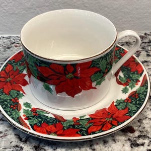 Gibson Holiday Poinsettia Coffee Cups and saucers.  4 sets available. sold individually