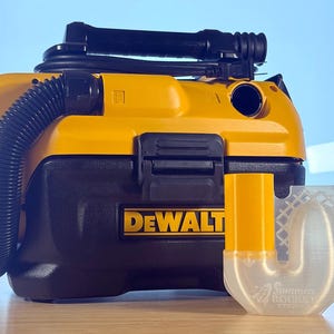 May include: A yellow and black DEWALT portable vacuum cleaner with a black hose and handle. A yellow and clear plastic attachment is next to the vacuum. The text "Summers Rocket" is on the attachment.
