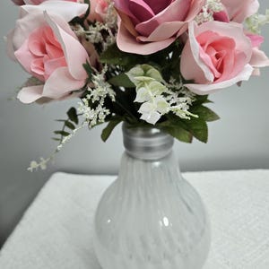 Light bulb vase with flowers