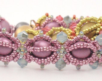 May include: Two beaded bracelets, one with pink and clear beads and the other with gold and pink beads.