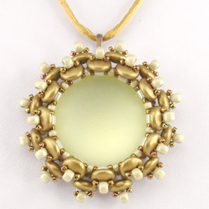 May include: A gold and white beaded necklace with a round pendant. The pendant is made of gold and white beads and has a light yellow center.