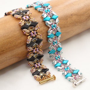 May include: Two beaded bracelets with intricate patterns. One bracelet features black, gold, and pink beads, while the other features turquoise, silver, and pink beads.