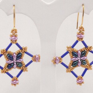 May include: A pair of gold and blue beaded earrings with a starburst design. The earrings feature purple and green beads in the center.