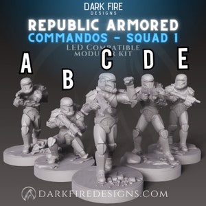May include: Five gray plastic miniature figures of Republic Commando soldiers, each with a different pose, holding weapons. The figures are standing on circular bases with a rocky texture. The text "REPUBLIC ARMORED COMMANDOS - SQUAD 1" is at the top of the image.
