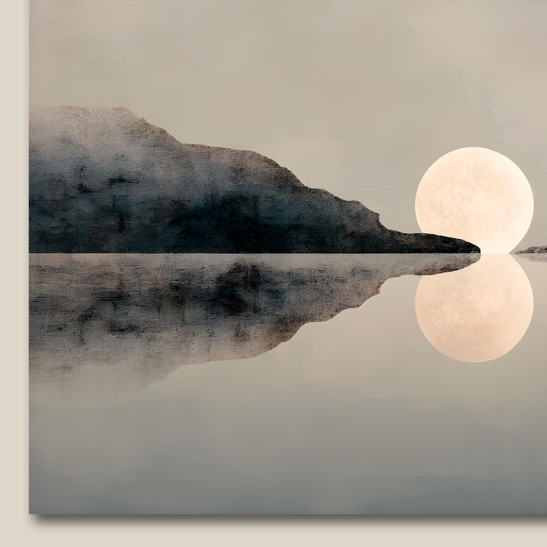 May include: A wall art print featuring a dark, textured mountain silhouette reflected in calm water. A large, pale, circular moon sits on the horizon line, casting a soft, glowing reflection into the water below against a muted, neutral background.