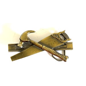 1981 Tools Solid Brass Vintage Belt Buckle by the Great American Buckle Co. - Hammer, Saw, Level - Serial #H851
