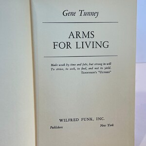 May include: A book titled "Arms for Living" by Gene Tunney. The book cover is cream coloured with black text. The quote "Made weak by time and fate, but strong in will To strive, to seek, to find, and not to yield. TENNYSON'S "ULYSSES"" is printed on the cover. The book is published by Wilfred Funk, Inc. in New York.