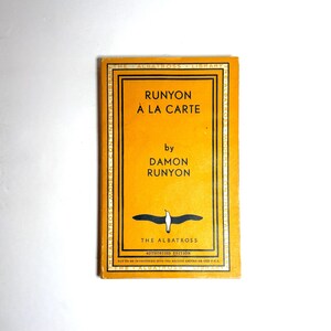 May include: A vintage book with a yellow cover, titled "Runyon à la Carte" by Damon Runyon. The cover features black text and an albatross illustration. It is an authorised edition from The Albatross Library.