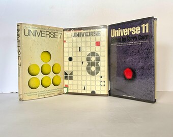 May include: Three hardcover books with the title "Universe" on the spine. The first book is titled "Universe 7" and features a yellow circle design. The second book is titled "Universe 8" and features a black and white geometric design. The third book is titled "Universe 11" and features a red circle design.