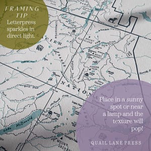 May include: A detailed map print with a vintage aesthetic, featuring a light blue and gray color scheme. The map highlights geographical features with text labels and is from Quail Lane Press. The text on the map reads "Framing Tip" and "Place in a sunny spot or near a lamp and the texture will pop!"