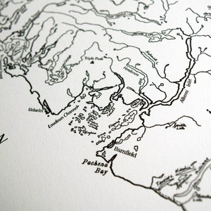 May include: A detailed black and white map showing coastal features and place names. Features include Ucluelet, Loudoun Channel, and Pachena Bay. The map has a vintage, nautical chart aesthetic.