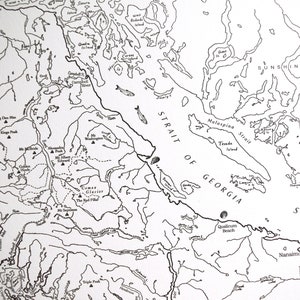 May include: A detailed black and white map depicting the Strait of Georgia and surrounding areas, including islands, rivers, and mountain peaks. Features place names like Qualicum Beach and Nanaimo.