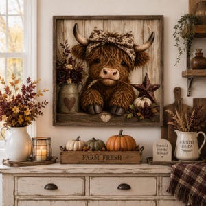 May include: A square wooden wall art piece featuring a fluffy brown Highland cow with a patterned bow between its horns, holding a wheat stalk in its mouth. The cow is set against a vertical plank background with a metal star and a small heart.