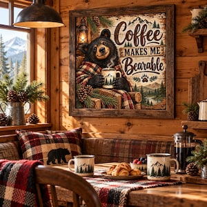 May include: A square wooden-framed wall sign featuring a black bear wrapped in a red and black plaid blanket, holding a steaming mug. The text reads Coffee MAKES ME Bearable. The artwork includes pine trees, mountains, and a lantern illustration.