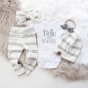 soft neutral newborn baby coming home outfit 5 piece outfit. Hello I am new here newborn baby outfit. Gender surprise newborn coming home outfit. Grey and white soft texture newborn baby outfit for gender surprise birth.