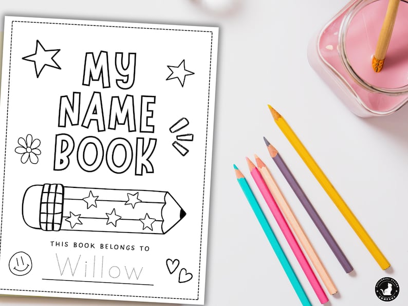 May include: A black and white colouring book titled "MY NAME BOOK" with a pencil illustration and the text "THIS BOOK BELONGS TO Willow". Colouring pencils in various colours are arranged on a white surface.