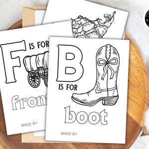 May include: Black and white coloring pages featuring the letters F and B with illustrations of a wagon and a cowboy boot. The text "F is for wagon" and "B is for boot" is included on the pages.