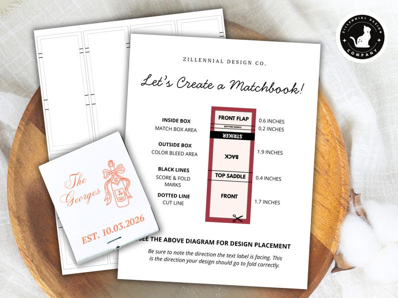 May include: A white matchbook design guide with a diagram showing dimensions in inches. The guide includes a matchbook with the text "The Georges" and the date "EST. 10.03.2026". The design is on a wooden tray.