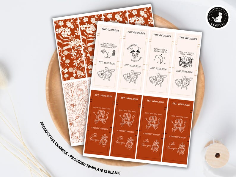 May include: Sheets of wedding-themed labels with floral and decorative designs. The labels feature the text "The Georges", dates, and various illustrations, including hearts and champagne glasses. The color scheme is a mix of cream and rust.