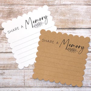 May include: Two brown and white cards with scalloped edges. The cards have the text "Share a Memory" with a small leaf design printed on them.