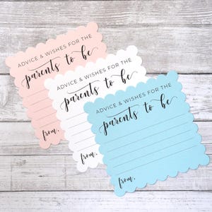 May include: Two baby shower advice cards with scalloped edges. The cards are pink, white, and blue. The text on the cards reads "Advice & Wishes for the parents to be" and "from."
