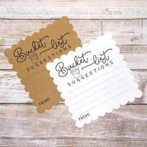 May include: Two blank bucket list suggestion cards. One card is brown with white lines and the other is white with black lines. Both cards have a scalloped edge and feature the text "Bucket list suggestions" with a small bucket icon.