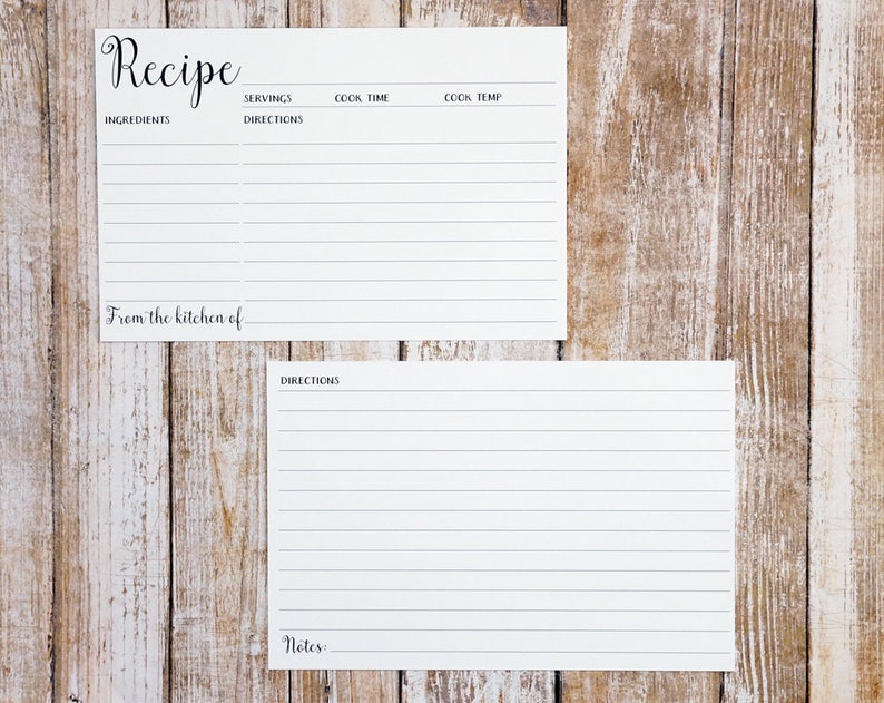 May include: Two blank recipe cards with lined sections for ingredients, directions, servings, cook time, cook temp, and notes. The cards are on a wood background.