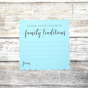 May include: A light blue card with scalloped edges, inviting guests to share their favorite family traditions. The card has the text "Share your favorite family traditions" and "from:" printed in black.