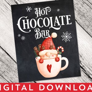 May include: A black chalkboard-style sign featuring the white text HOT CHOCOLATE BAR with snowflake accents. A cartoon gnome wearing a red plaid hat with antlers sits inside a white mug decorated with a red heart, cinnamon sticks, and a candy cane.