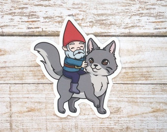 Gnome Riding a Cat STICKER | 3" Vinyl Die Cut Waterproof Cartoon of Garden Gnome on the back of a Gray Fluffy Kitty Cat