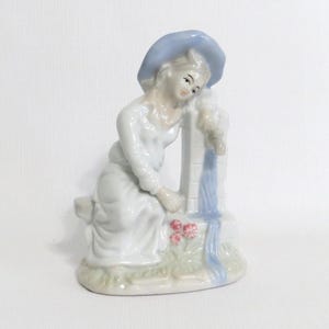 Vintage Figurine Woman Sitting at a Well