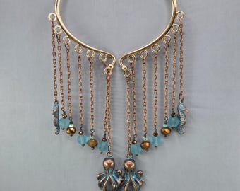 Pendientes tipo ear cuff con forma de pulpo azul y pátina de cobre, sin necesidad de perforación (par o individual)