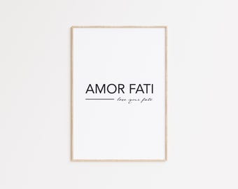 May include: A framed print with the text "AMOR FATI" and the phrase "love your fate" in cursive script below.