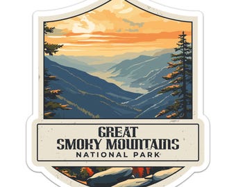 May include: A sticker featuring a scenic view of the Great Smoky Mountains National Park. The design includes a mountain range, trees, and a sunset. The text "Great Smoky Mountains National Park" is displayed in a rectangular banner.