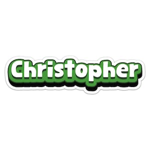 Könnte beinhalten: Ein weißer Namensaufkleber mit dem Namen "Christopher" in grünen Buchstaben mit weißem Rand und schwarzem Schatten.