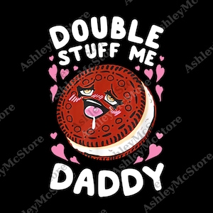 May include: A black graphic with a cartoon cookie character with a suggestive expression. The text "DOUBLE STUFF ME DADDY" is in white, with pink hearts around the cookie.