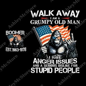 May include: Black graphic design featuring a gorilla wearing sunglasses and holding an American flag, with the text "WALK AWAY I AM A GRUMPY OLD MAN." Additional text reads "I HAVE ANGER ISSUES AND A SERIOUS DISLIKE FOR STUPID PEOPLE."