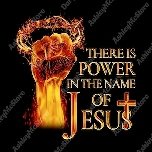 May include: A digital graphic on a black background. A fiery fist clenches beneath a crown of thorns. Gold text reads "THERE IS POWER IN THE NAME OF JESUS" with a cross. The image has a religious theme.