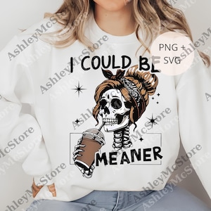 May include: White sweatshirt with a graphic of a skull wearing a bandana and drinking from a coffee cup. The text reads "I COULD BE MEANER". Stars are also included in the design.