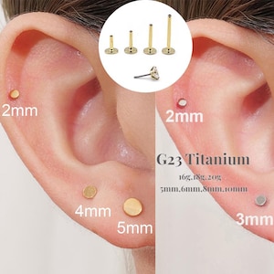 May include: Close-up of ear piercings with gold-colored studs in various sizes, including 2mm, 3mm, 4mm, and 5mm. A small inset shows several gold-colored labret studs. The text "G23 Titanium" and size details are also visible.