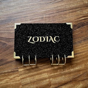 Zodiac Savings Binder dla Wypełniania Gotówki i Wyzwań Oszczędnościowych