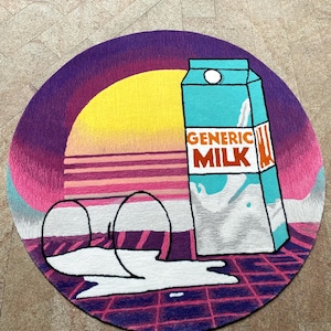 May include: A round rug featuring a retro sunset design with a yellow sun and pink and purple hues. A carton of "GENERIC MILK" in teal and white is depicted, with spilled milk and two empty glasses. The rug has a grid pattern.