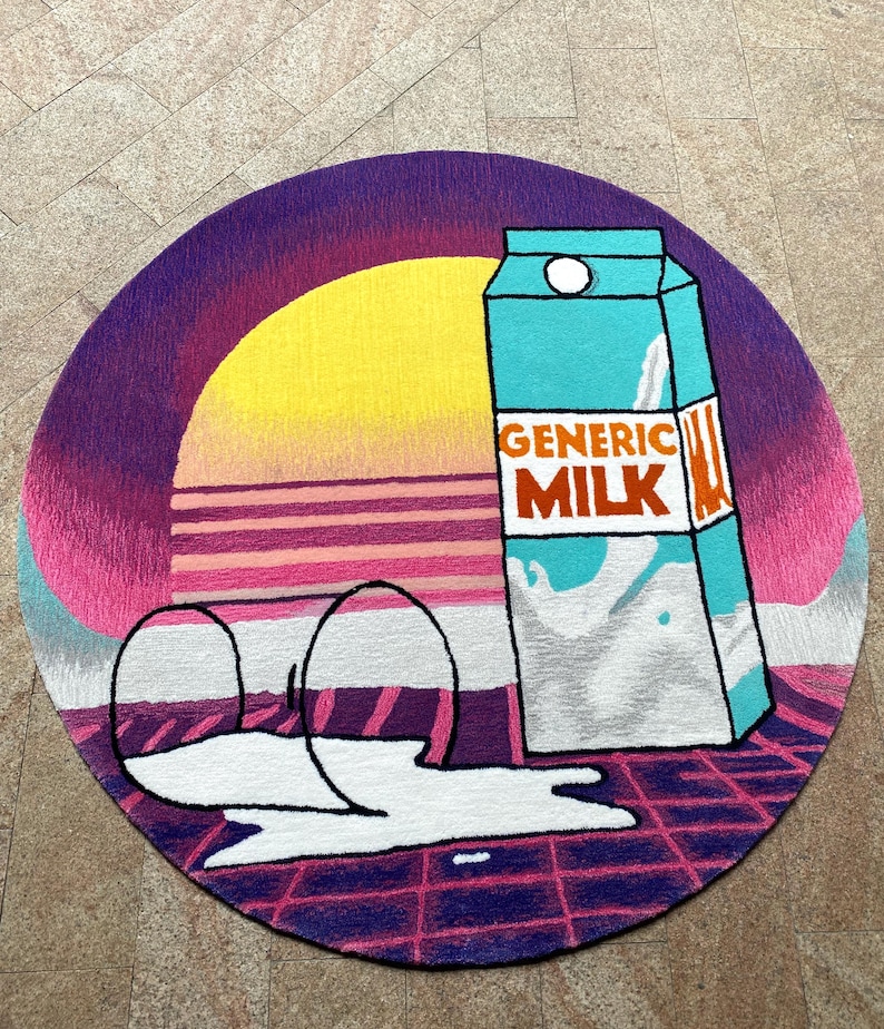 May include: A round rug featuring a retro sunset design with a yellow sun and pink and purple hues. A carton of "GENERIC MILK" in teal and white is depicted, with spilled milk and two empty glasses. The rug has a grid pattern.